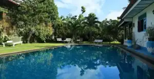 Beautiful pool and lush garden at KYO GARDEN VILLA for relaxation.