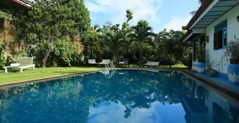 Beautiful pool and lush garden at KYO GARDEN VILLA for relaxation.